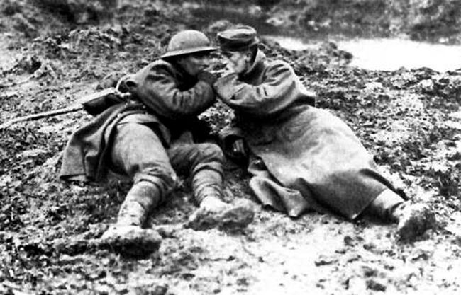 Two Canadian Soldiers Share Cigarettes on the Battlefield. [Image Source: stcatharinesstandard.ca]